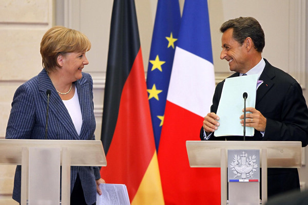 Sarkozy, Merkel push euro integration