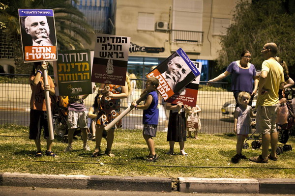 Biggest rally in Israel's history presses PM