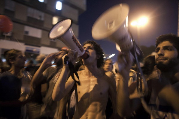 Biggest rally in Israel's history presses PM