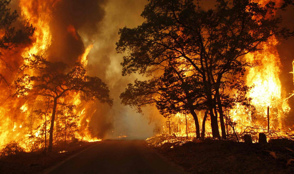 2 dead in Texas wildfires, homes destroyed