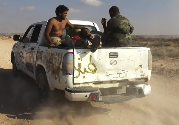 Libya's NTC vows to capture Gadhafi hometown soon