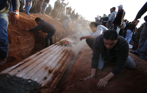 Libya buries 170 bodies discovered in mass grave