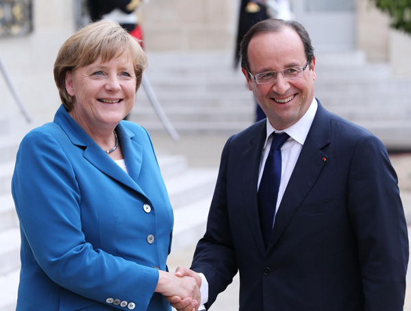 Hollande, Merkel meet to solve eurozone crisis