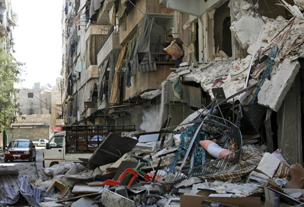 Clashes continue in Syria, killing scores