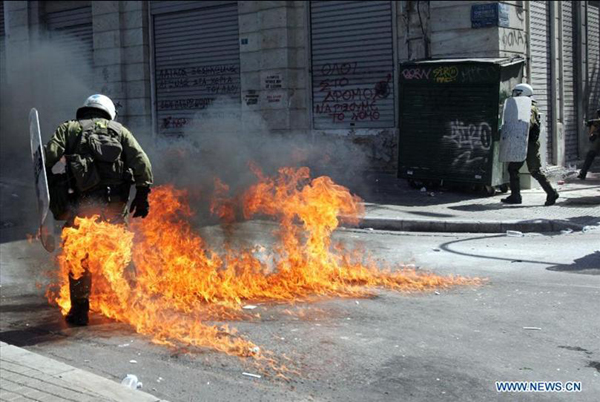 Protestors clash with anti-riot policemen in Athens