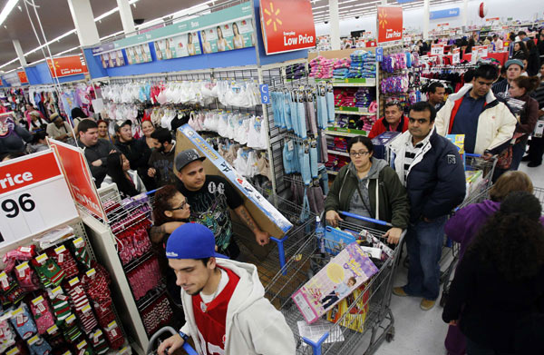 Shoppers line the aisles on Thursday looking for 'Black Friday' deals at a WalMart store in Salem, New Hampshire. Jessica Rinaldi / Reuters US shoppers welcome early start to 'Black Friday'