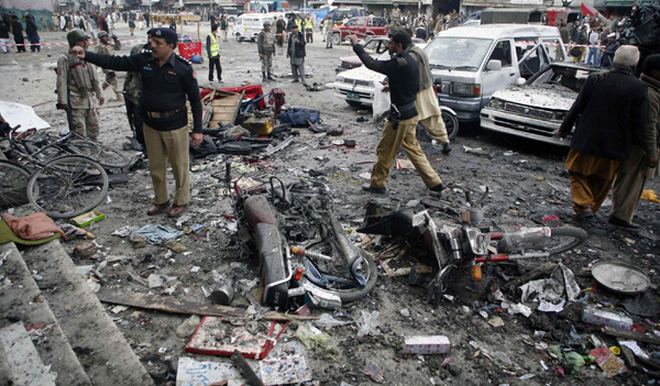 Twin explosions kill over 100 in Pakistan