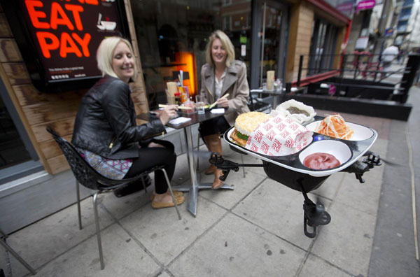 Flying trays keep customers amused