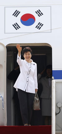 South Korean President Park Geun-hye waves as she embarks an airplane at the Seoul Air Base of South Korean air force in Seongnam, south of Seoul June 27, 2013, before she leaves for China. Park will arrive in Beijing on Thursday for her four-day state visit and will hold her first summit with Chinese President Xi Jinping. Park's visit opens new chapter in China-ROK ties
