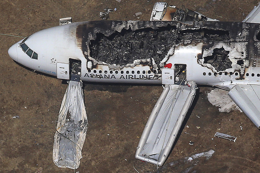 An aerial view of an Asiana Airlines Boeing 777 plane is seen after it crashed while landing at San Francisco International Airport in California on July 6, 2013. Two people were killed and 130 were hospitalized after the plane crash-landed at San Francisco International Airport on Saturday morning, San Francisco Fire Department Chief Joanna Hayes-White said. The figures cited by Hayes-White leave 69 people still unaccounted for in the accident. The Boeing 777, which had flown from Seoul, South Korea, was carrying 307 people. Asiana flight crashed at SFO