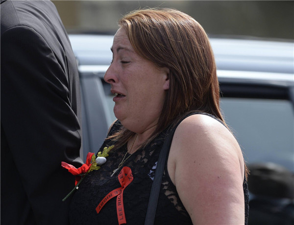 Lyn Rigby arrives for the funeral of her son, Fusilier Lee Rigby, at the parish church in Bury, northern England July 12, 2013. UK murdered soldier buried