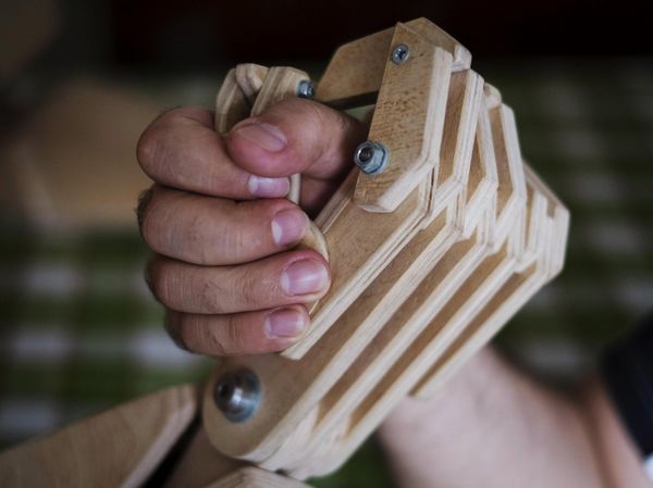 Crane operator creates wooden robot