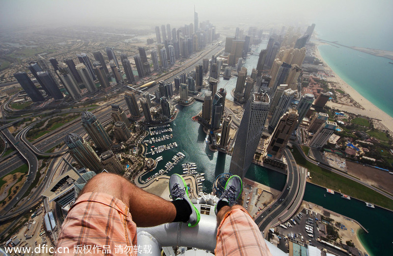Daredevils taking selfie over Dubai skyscraper