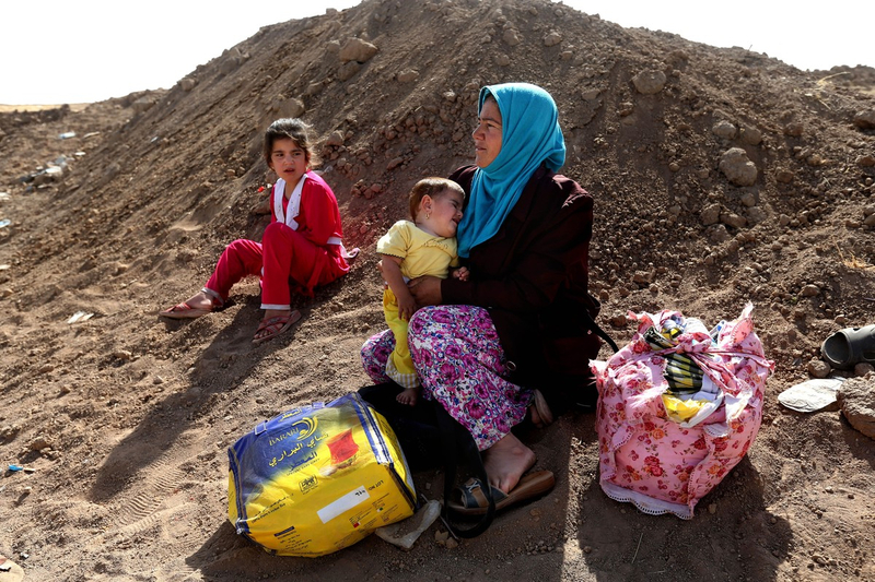 Northern Iraqis flee their home, avoiding Sunni millitans