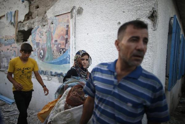 Carnage at UN school as Israel pounds Gaza Strip