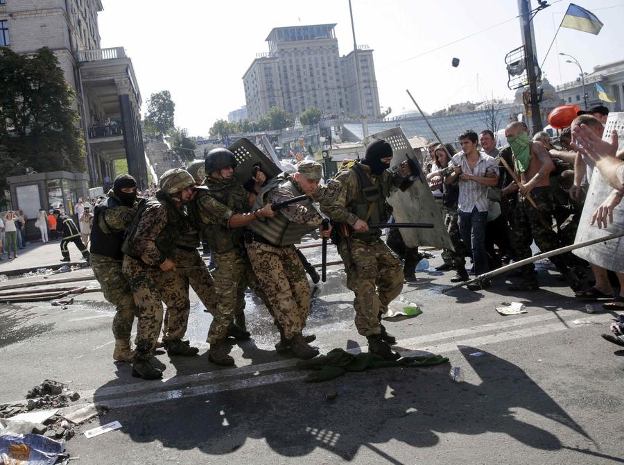 Smoke rises during clashes in Kiev