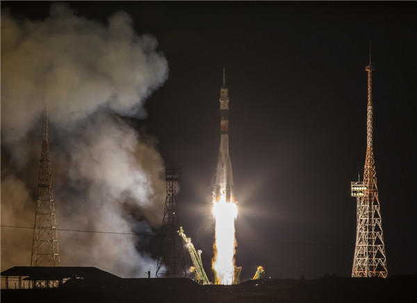 Multi-national crew blasts off for space station