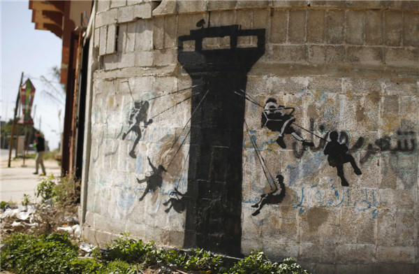 British street artist paints works in Gaza