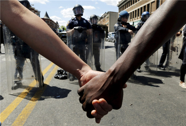 Police descend on Baltimore to enforce curfew after riots