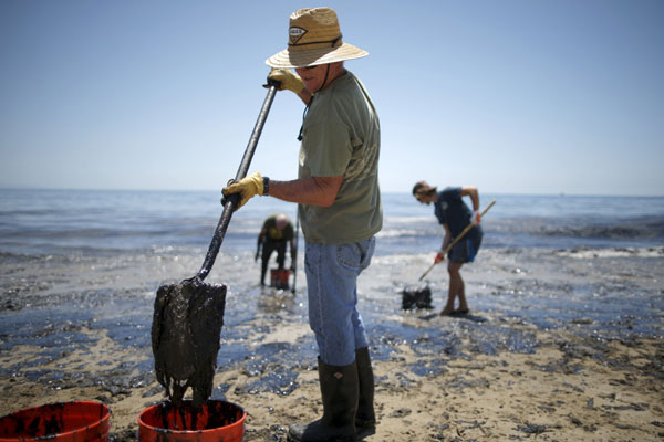 Crews work to clean California beach fouled by oil pipeline spill