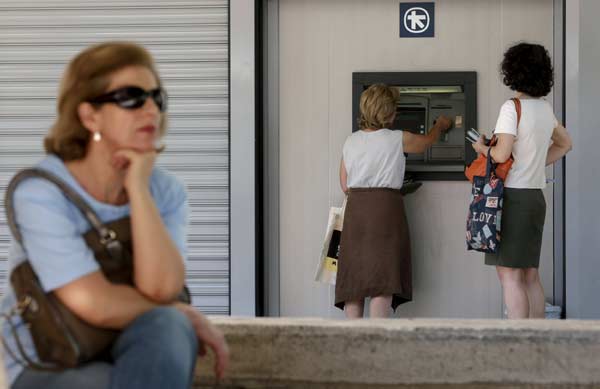 Greece faces tough conditions under deal with euro zone