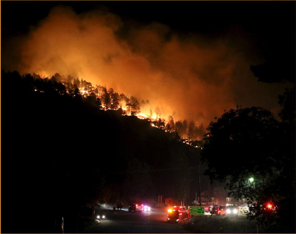 Rain calms California fire that jumped freeway, burned cars