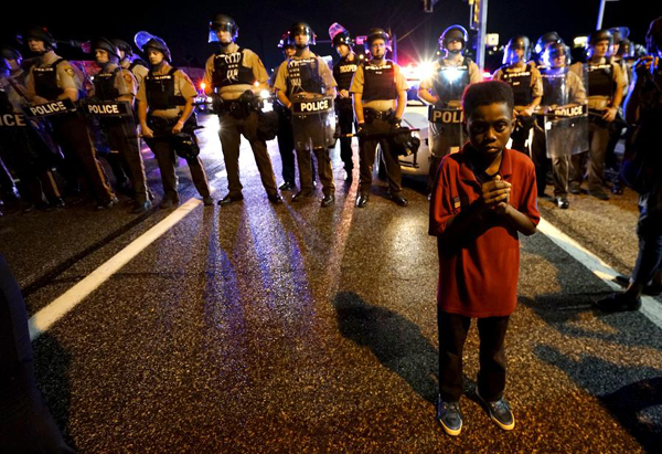 State of emergency called in Ferguson after gunfire mars protests