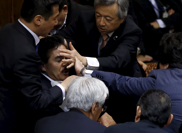 Japan's upper house committee passes controversial security bills