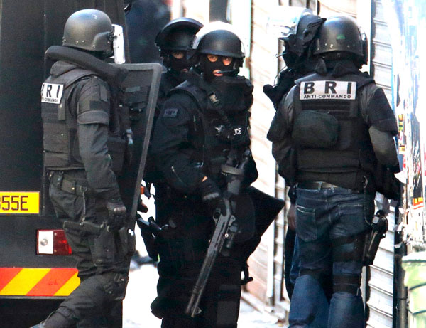 Gunshots rattle Paris suburb, police raid targets suspected attack mastermind