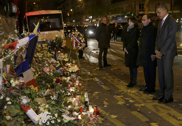 Obama visits Paris attack site, pays tribute to victims