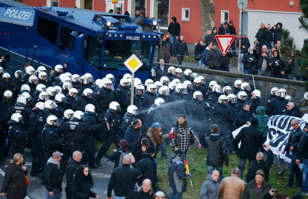 Protest goes violent as rift on refugees escalates in Germany