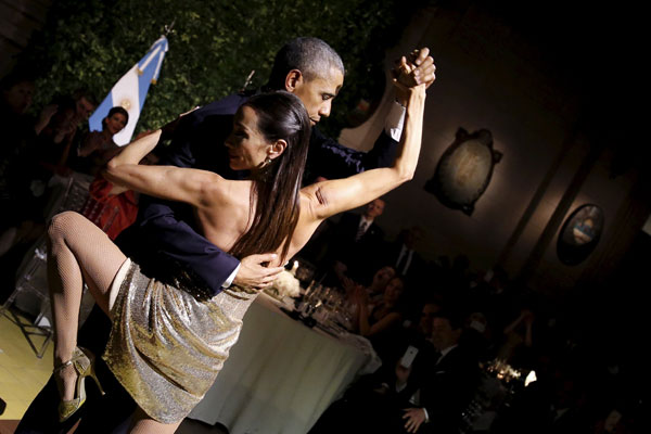 Obama dances tango during a state dinner in Argentina