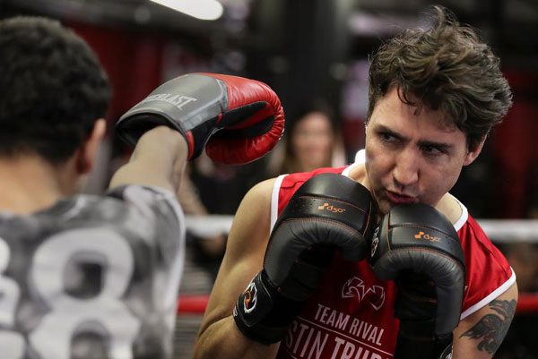 Canadian PM Trudeau slips from political ring to boxing ring
