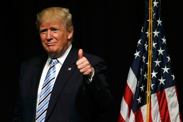 Trump wins enough delegates to secure Republican presidential nomination