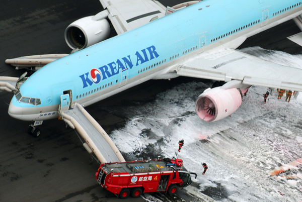 Korean Air plane terminates takeoff after engine catches fire