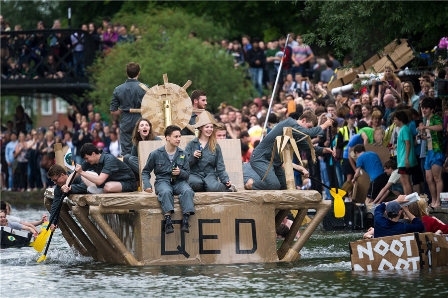 Cambridge students celebrate end of exams with cardboard boat race