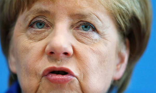 Defiant Merkel cuts short holiday to defend response to attacks