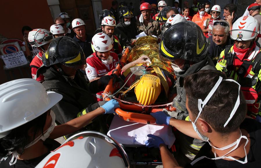 Italy rescuers toil through night as death toll hits nearly 250