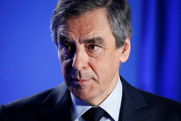 Fillon says not to quit French presidential race despite probe