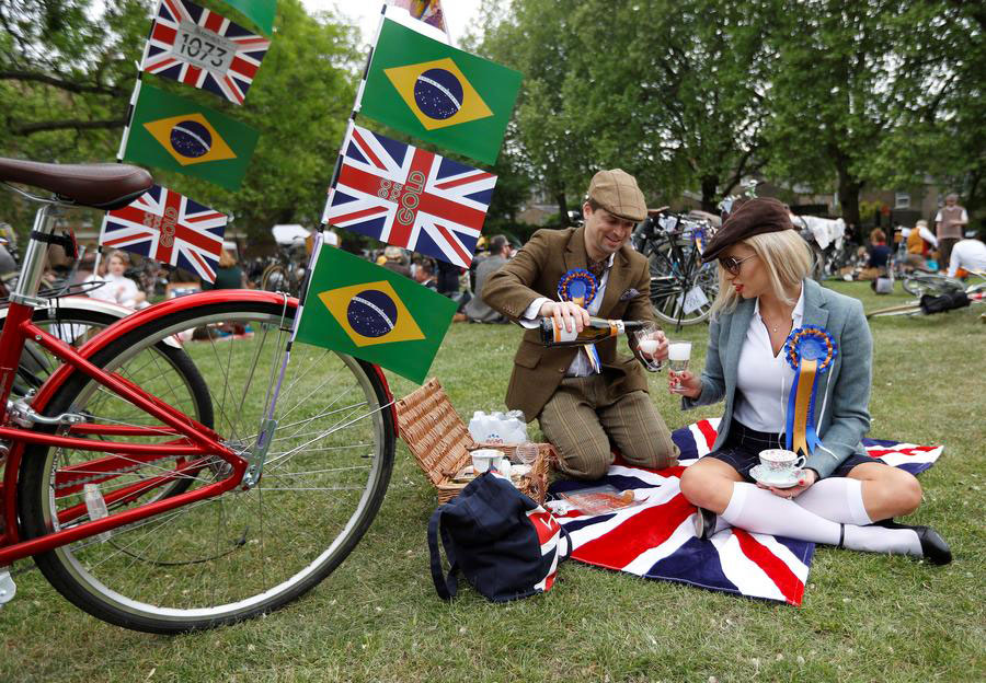 Hundreds of cyclists ride through The Tweed Run in London