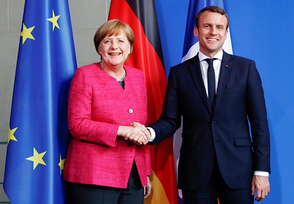 Merkel and Macron agree to draw up roadmap to deeper EU integration