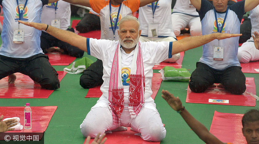 Thousands join India's Modi, hit the mat for International Yoga Day