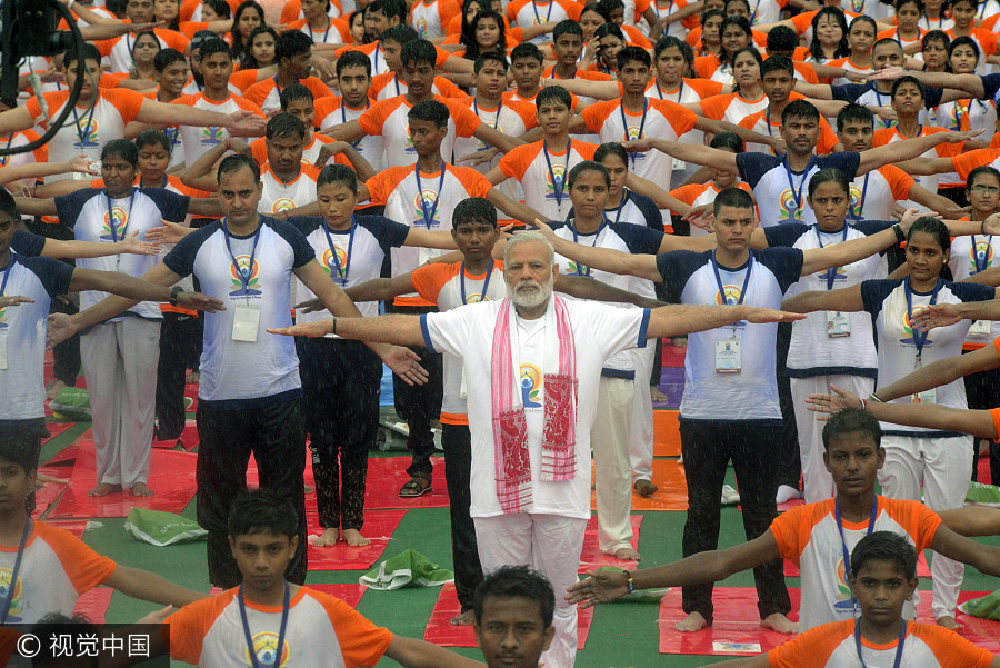 Thousands join India's Modi, hit the mat for International Yoga Day