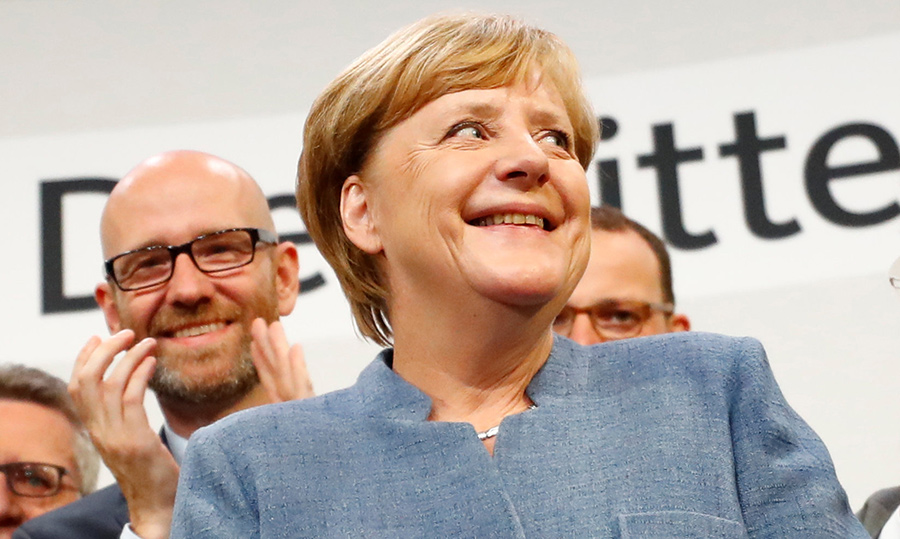 Merkel wins 4th term but nationalists surge in German vote