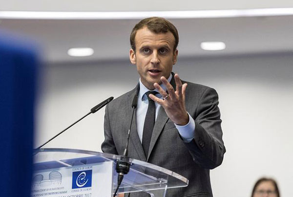 Macron signs France's controversial new anti-terror legislation