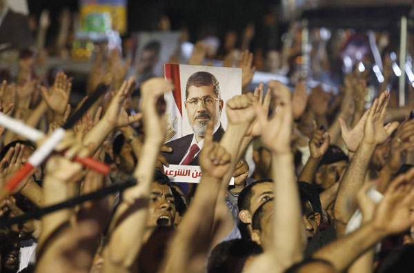Egypt's prosecution imposes travel ban on Morsi