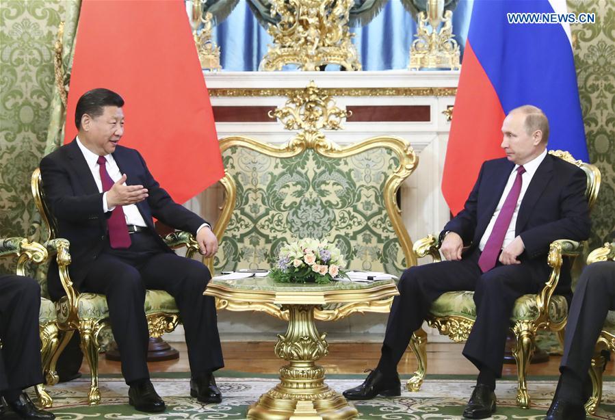China, Russia pledge to play role of ballast stone for world peace