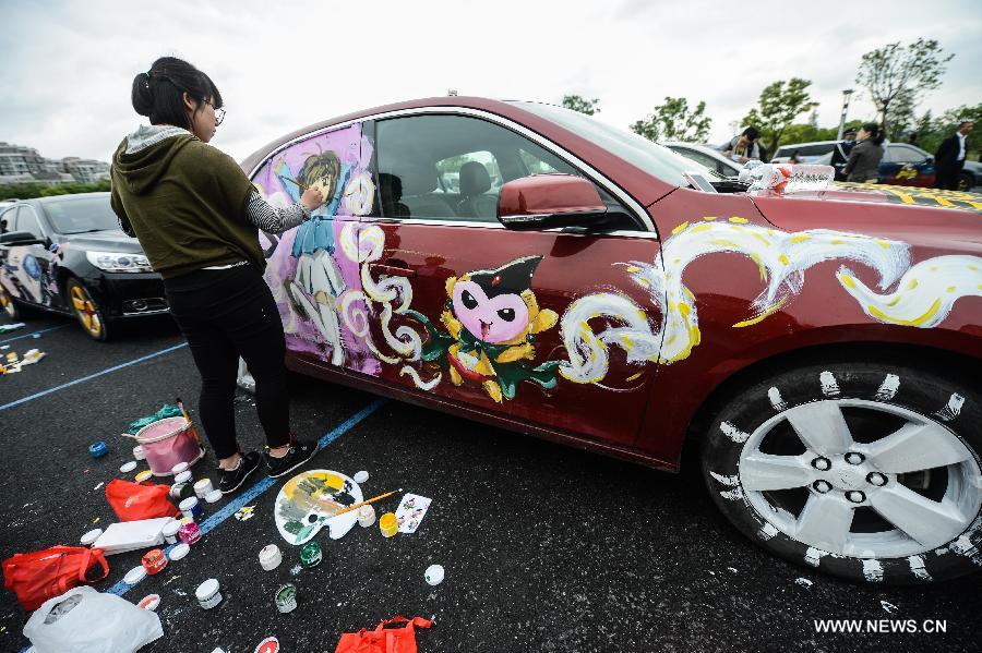 Cars with colorful cartoon drawings parade in Hangzhou