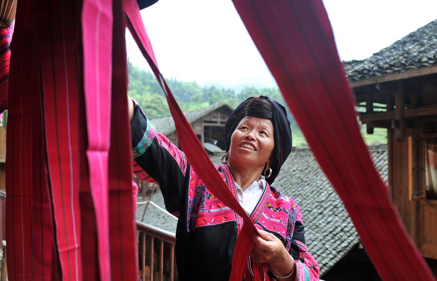 Weaving profits, tradition with hand-made dresses