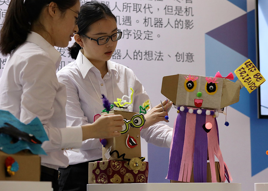 Participants try their hands on making robots at Summer Davos
